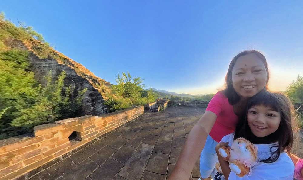 Mother And Daughter With The Low Sun/Mountains