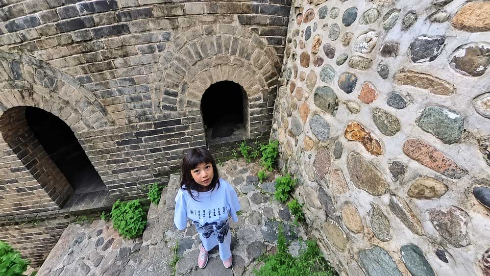 Sleeping On The Great Wall Of China: Inside A Watchtower Our Daughter In A Great Wall T-Shirt Climbing The Steps At Gubeikou