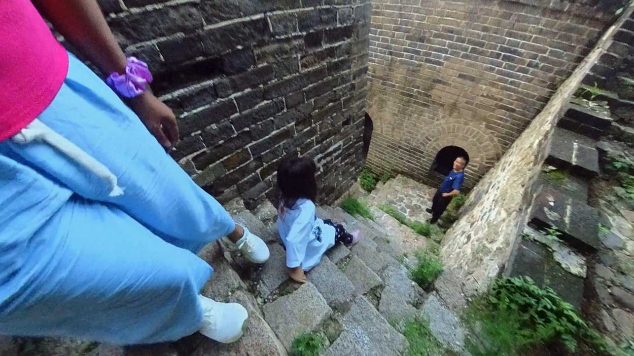 Is The Great Wall Of China Hard To Climb? What It'S Really Like Steep Great Wall Staircase With A Person For Scale