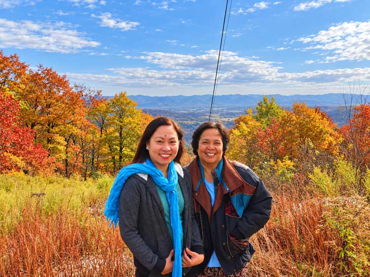 Cavanal Hill Fall Colors: Driving Oklahoma'S &Quot;World'S Highest Hill&Quot; Mother And Daughter In Front Of Orange And Gold Fall Trees And Golden Grasses Near The Cavanal Hill Summit.